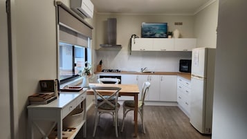 Standard Apartment, 1 Bedroom | Private kitchen | Electric kettle, dining tables