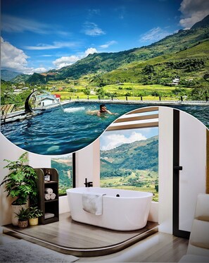 A modern bathroom with a large bathtub, a potted plant, and a view of a swimming pool and mountains. - En Hotel Sapa (Ta Van)