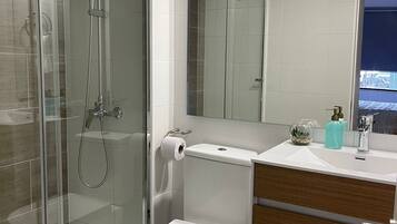 Shower, hair dryer, towels, soap