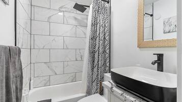 Shower, hair dryer, towels, soap