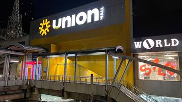 A building with a large sign reading "Union Mall" and another sign for "World."