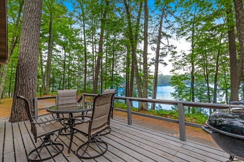 Snowy lake-view cabin with fireplace, full kitchen, TV, dock, & DVD player