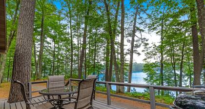 Snowy lake-view cabin with fireplace, full kitchen, TV, dock, & DVD player