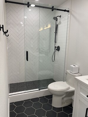 Shower, hair dryer, towels, soap