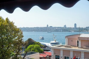 A view of a cityscape with a river, boats, and buildings in the background. - 216 Bosphorus (Istanbul)