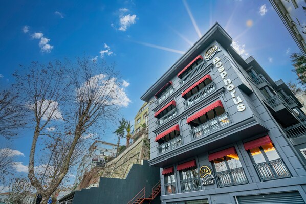 A multi-story building with balconies and a sign reading "Bop Bar". - 216 Bosphorus (Istanbul)