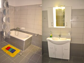 Combined shower/bathtub, hair dryer, towels