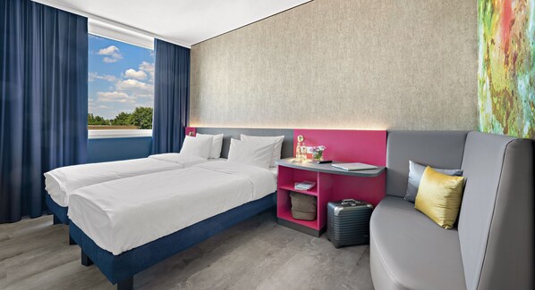 Hypo-allergenic bedding, desk, laptop workspace, blackout curtains