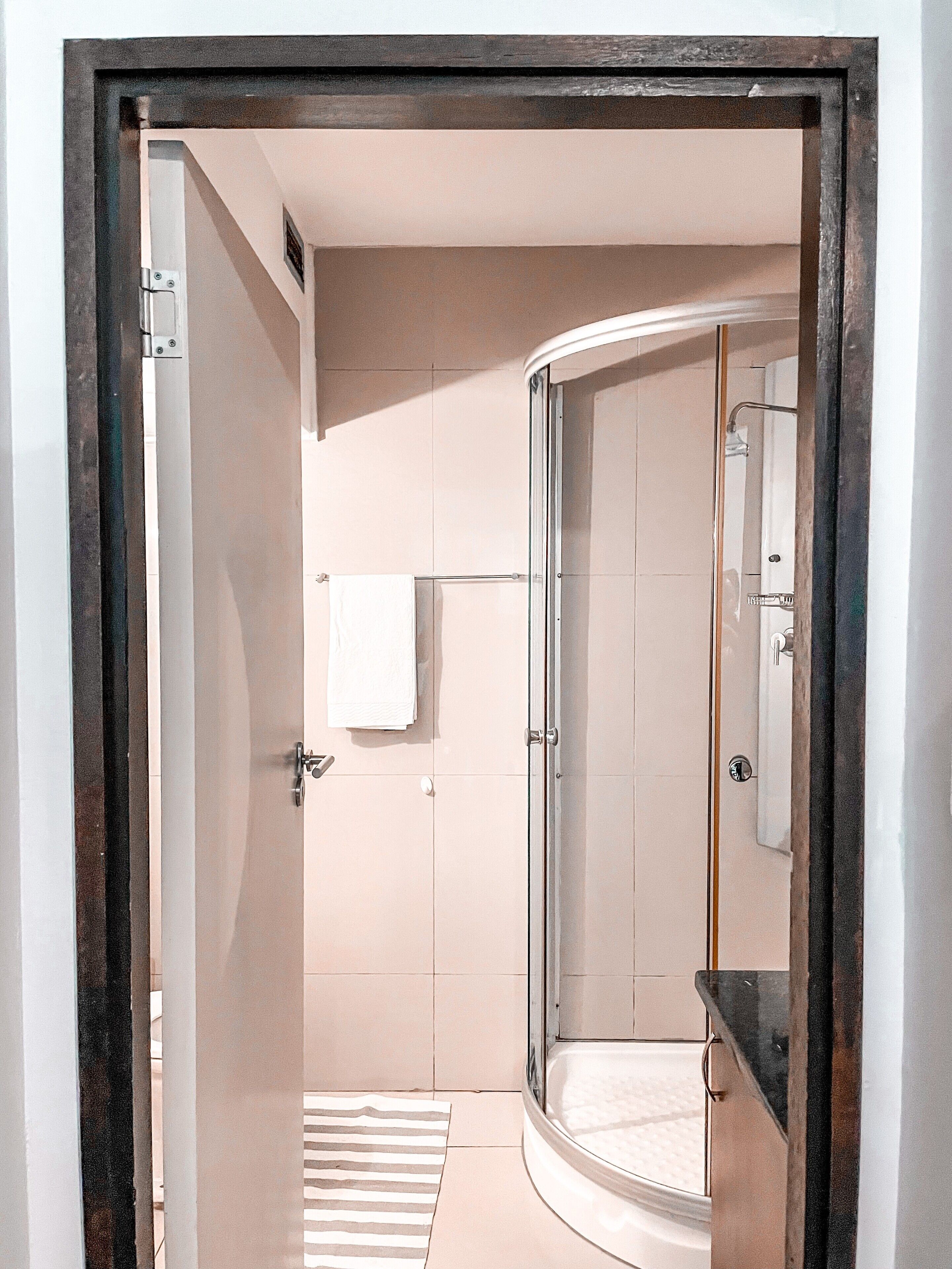 Shower, hair dryer, towels, toilet paper