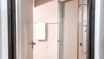 Shower, hair dryer, towels, toilet paper