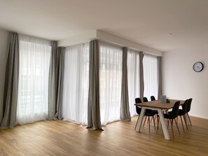 Family Apartment, 2 Bedrooms, Balcony | Living area | 43-inch flat-screen TV with digital channels, TV - Stylish Apartments in Ibbenbüren (Ibbenbueren)