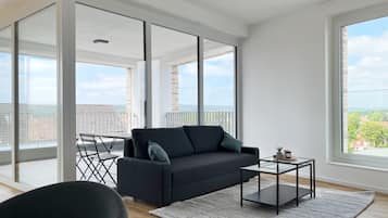 Deluxe Apartment, 3 Bedrooms | Living area | 43-inch flat-screen TV with digital channels, TV