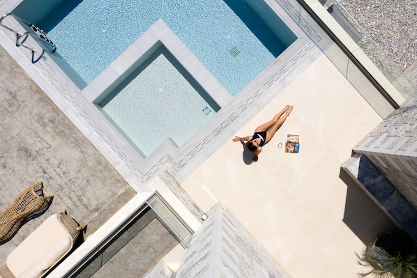 Outdoor pool, a heated pool, pool loungers