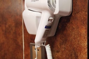 A hairdryer mounted on a wall with a cord. - Loft Hotel (Changyi)