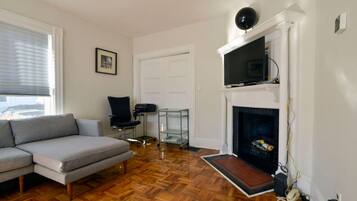 Smart TV, fireplace, books, offices