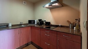 A kitchen with a microwave, coffee maker, and sink. - RURAL HOUSE WITH VIEWS OF THE GREEN ASTURIAN MOUNTAINS (Pola de Lena)