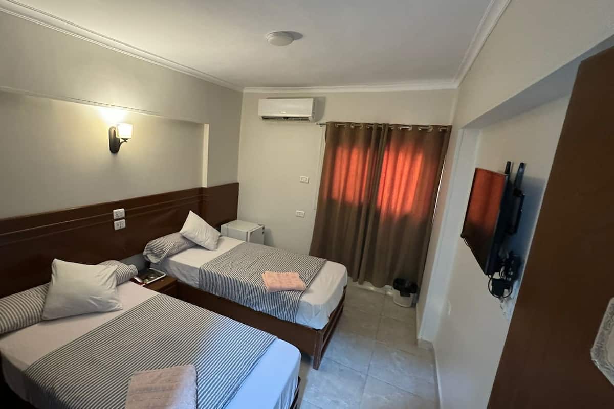 Doppia Economy, 2 letti singoli | Tende oscuranti, Wi-Fi gratuito, lenzuola
