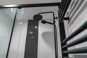 Shower, hair dryer, towels, shampoo