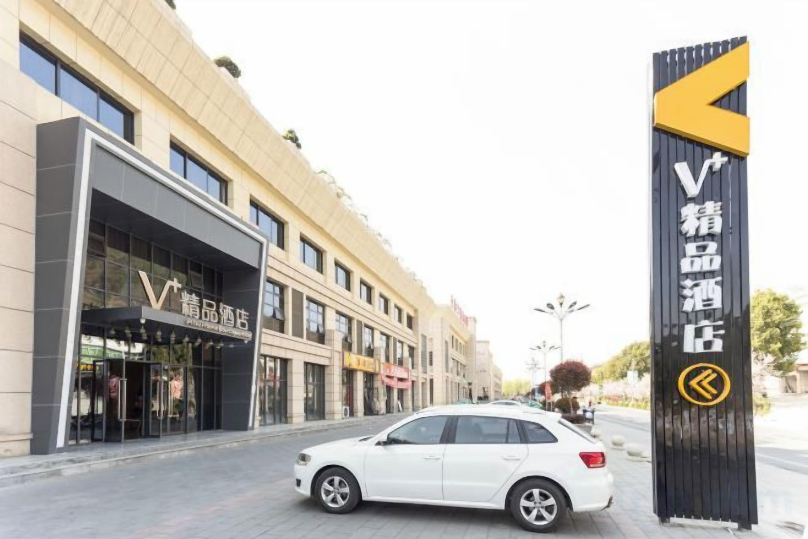 A hotel entrance with a sign indicating a VIP lounge.