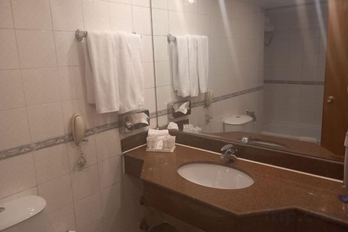Bathroom | Deep-soaking bathtub, rainfall showerhead, hair dryer, slippers