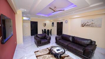 Apartment | Living area | 30-inch TV with cable channels