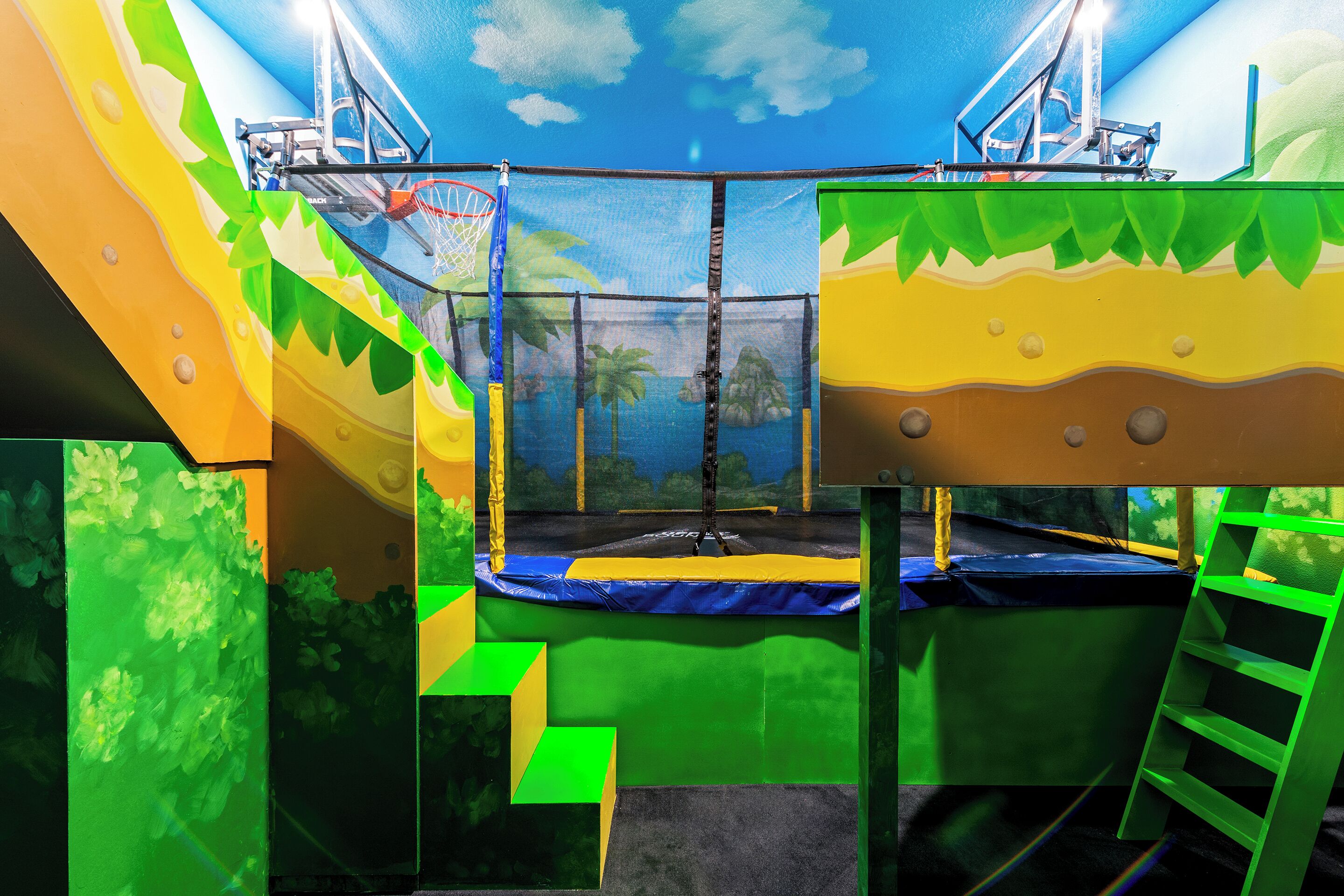 A trampoline area with netted safety, a basketball hoop, and a ladder.