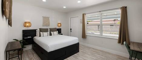 1 bedroom, desk, iron/ironing board, travel crib