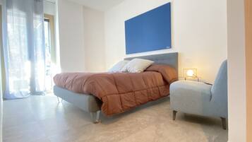 2 habitaciones, tabla de planchar con plancha, cuna de viaje y wifi