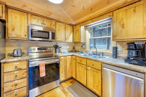 Enjoy cooking in this well-equipped kitchen with a microwave, oven, and dishwasher.