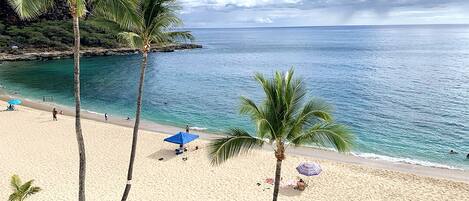 On the beach, sun loungers, beach towels