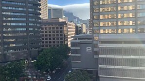 A cityscape with tall buildings, including a building with 'LUNO' signage. - Lovely Relaxing-1 Bedroon 703 Condo (Cape Town)