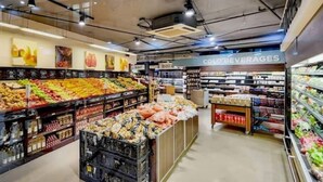 A grocery store with a variety of fresh produce, packaged goods, and a section labeled "COLD BEVERAGES". - Lovely Relaxing-1 Bedroon 703 Condo (Cape Town)