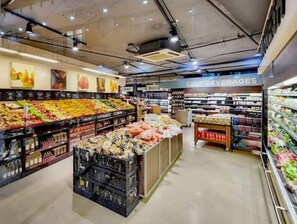 A grocery store with a variety of fresh produce, packaged goods, and a section labeled "COLD BEVERAGES". - Lovely Relaxing-1 Bedroon 703 Condo (Cape Town)
