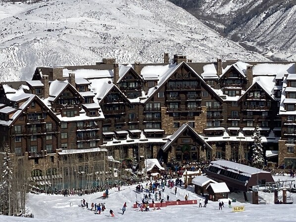 A snow-covered lodge with multiple log cabins, a ski slope, and a ski lift. - Beaver Creek Luxury 2BR, 2Bath ski-in & ski-out suite inside the Ritz-Carlton (Beaver Creek)