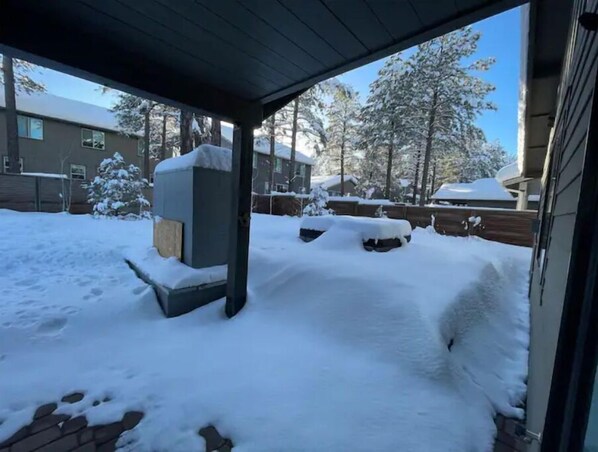 Guests can enter the property through the covered entrance along the brick pathway.