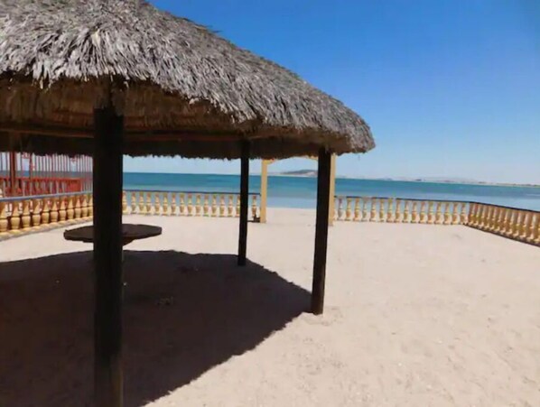 On the beach, sun loungers, beach towels