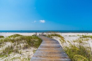 A wooden boardwalk leading to a beach with clear skies. - Poolside! 2 King Suites, Sleeps 8, Close to Beach, Newly Furnished (Gulf Shores)