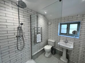 Shower, hair dryer, towels, toilet paper