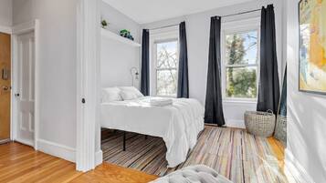 1 bedroom, desk, iron/ironing board, travel crib