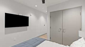 1 bedroom, desk, iron/ironing board, travel crib