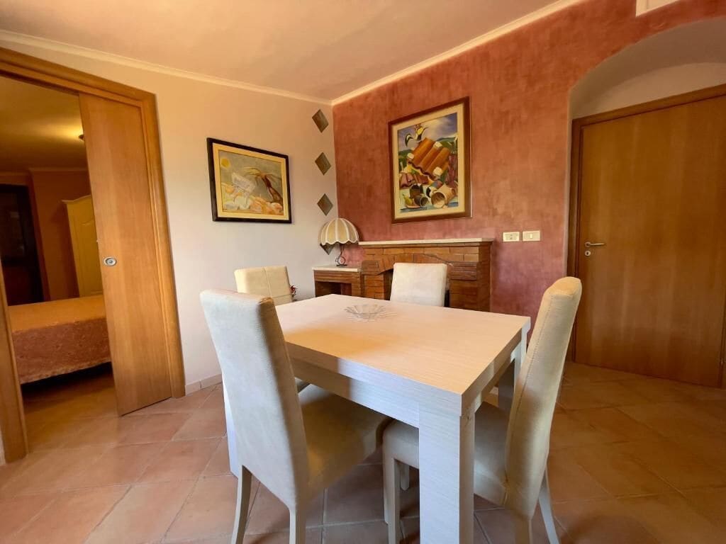 Deluxe Quadruple Room | Living area | 32-inch LED TV with cable channels