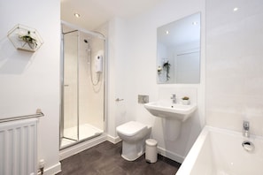 Bathtub, hair dryer, towels