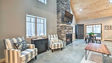 TV, fireplace, books
