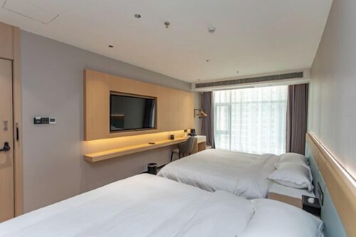 Wanjin Convenience Hotel (Beihai Qiaogang Fengqing Street)