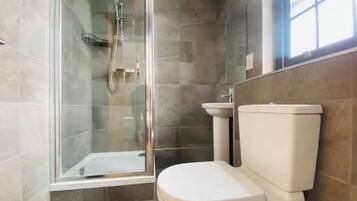 Shower, hair dryer, towels, soap