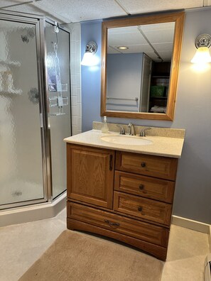 Shower, hair dryer, towels, soap
