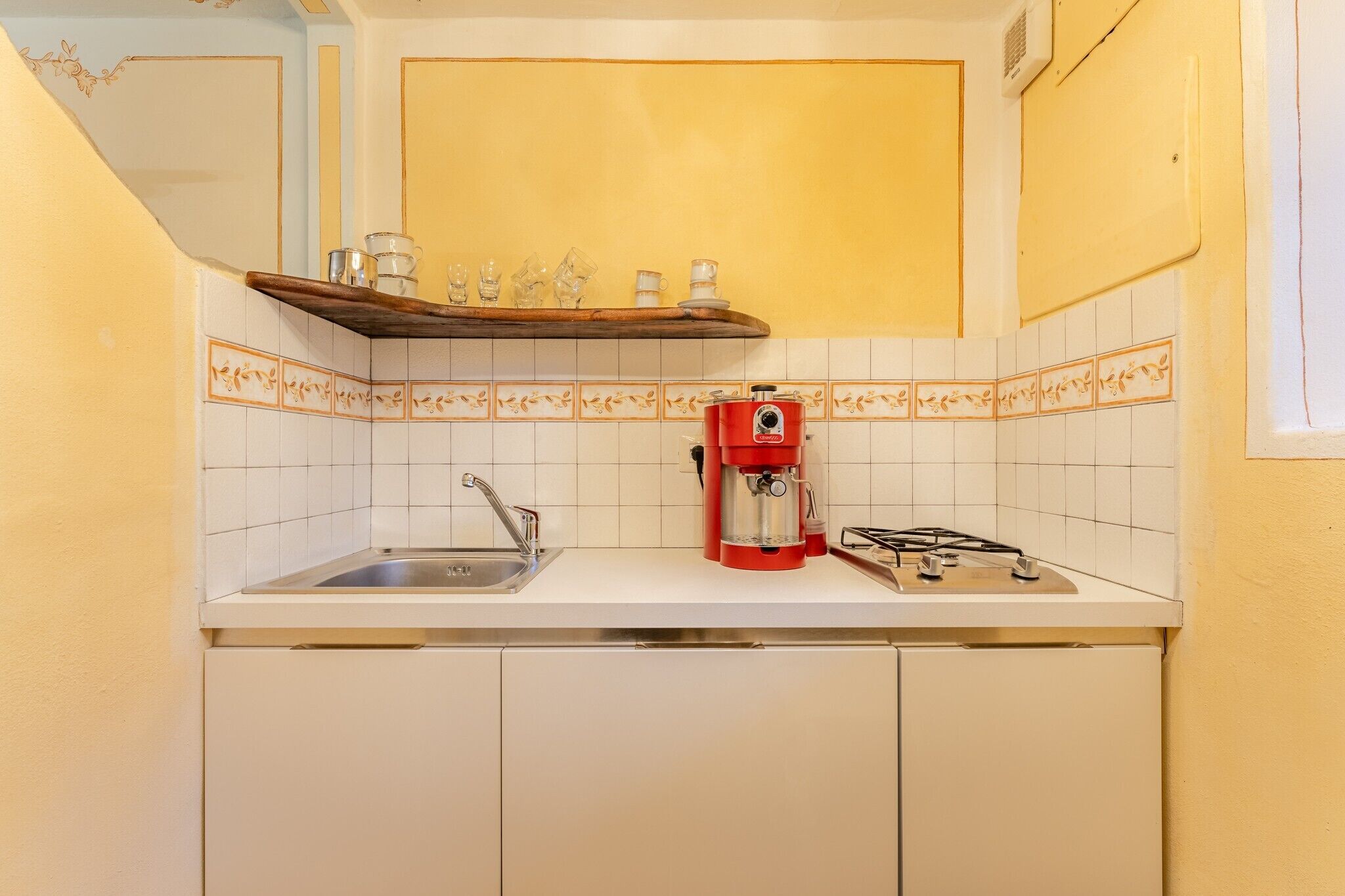 Fridge, stovetop, coffee/tea maker, cookware/dishes/utensils