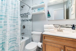 Shower, hair dryer, shampoo, toilet paper
