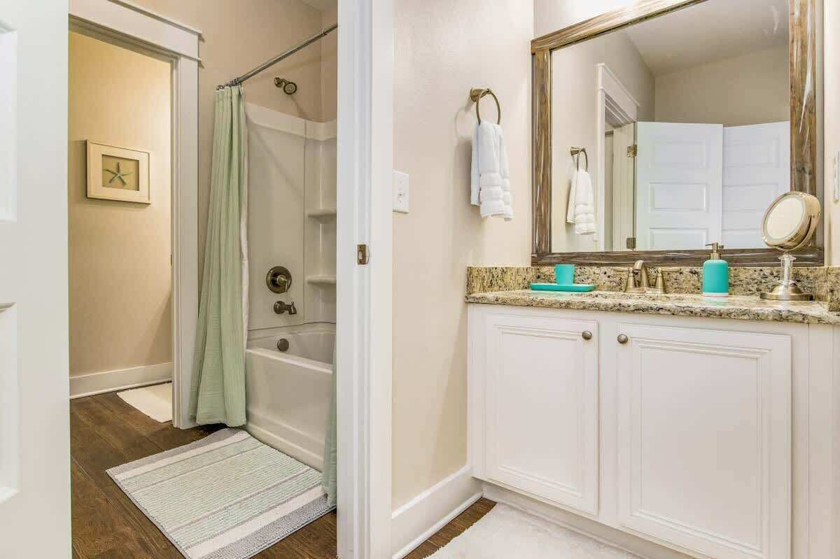 Bathroom with door separating shower
