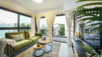 Apartment | Living area | 55-inch flat-screen TV with digital channels